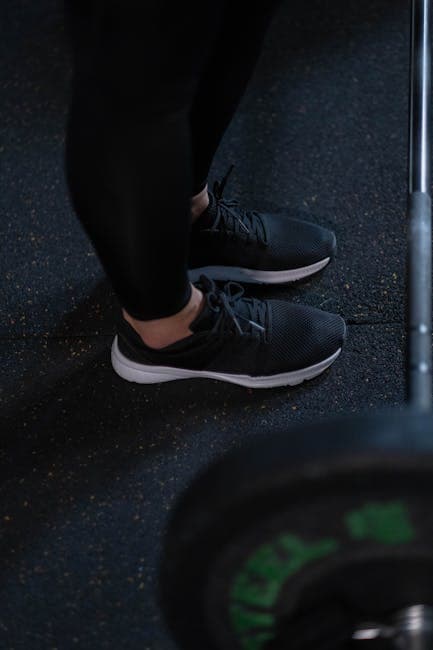 Black gym leggings flat-lay on light grey background