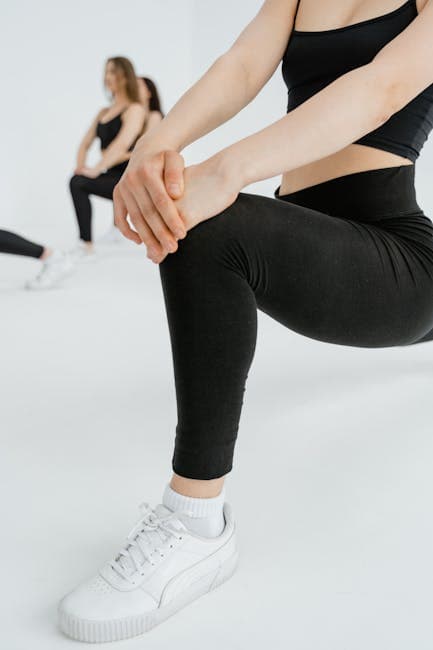Black athletic leggings detail with stitching visible