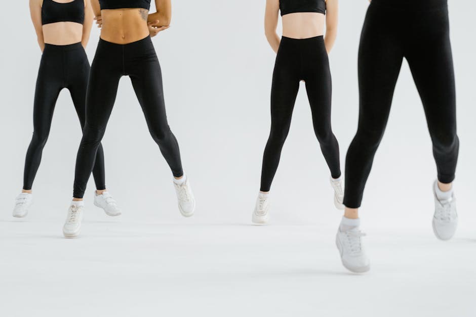 Folded black leggings on minimal table